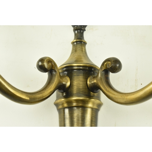 372 - A set of four Italian manner 20th century brass twin arm wall sconces lights. Each sconce having a c... 