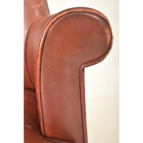 375 - An Edwardian / 1920s leather swivel office desk armchair. The chair having a curved backrest with sc... 