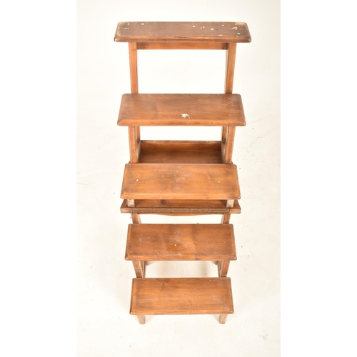 377 - An Edwardian early 20th century beech wood metamorphic set of library steps / chair. The chair havin... 