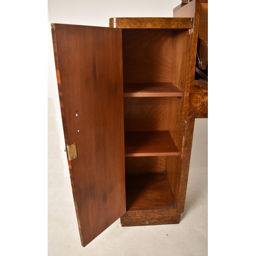 381 - An Art Deco early 20th century 1930s burr walnut fall front drinks cocktail cabinet. The cabinet hav... 