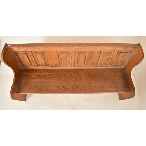 382 - A late Victorian late 19th century pine ecclesiastic church settle bench. The bench having a straigh... 