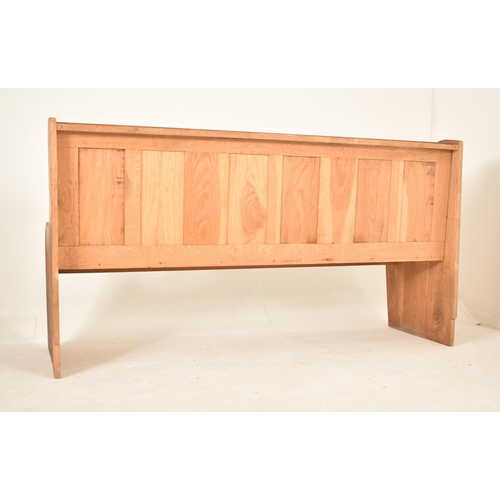 382 - A late Victorian late 19th century pine ecclesiastic church settle bench. The bench having a straigh... 