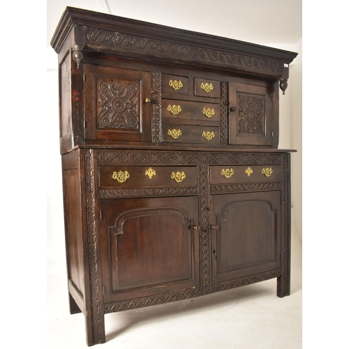 387 - A late 17th century / early 18th century oak court cupboard. The cupboard having a pediment atop wit... 