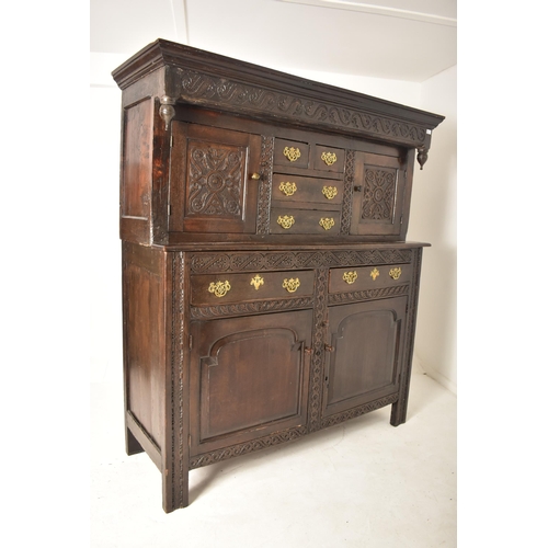 387 - A late 17th century / early 18th century oak court cupboard. The cupboard having a pediment atop wit... 