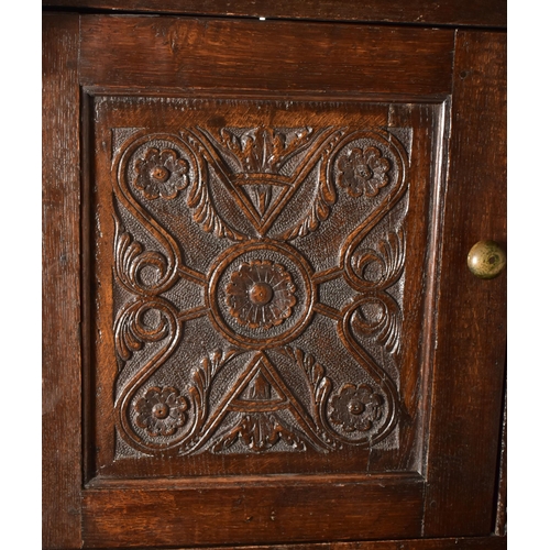 387 - A late 17th century / early 18th century oak court cupboard. The cupboard having a pediment atop wit... 