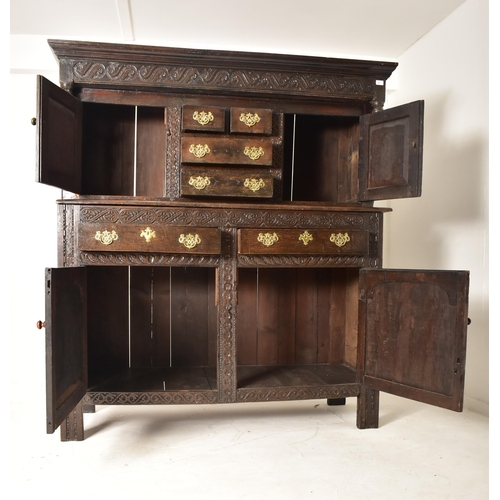 387 - A late 17th century / early 18th century oak court cupboard. The cupboard having a pediment atop wit... 