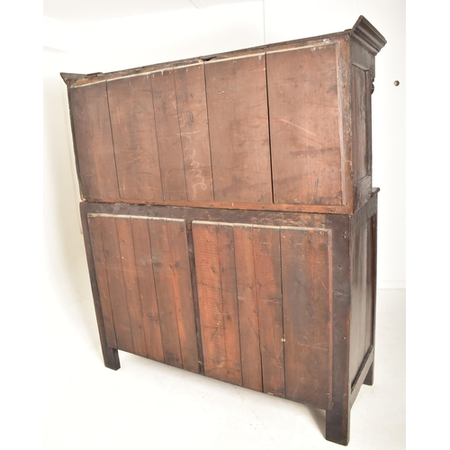 387 - A late 17th century / early 18th century oak court cupboard. The cupboard having a pediment atop wit... 