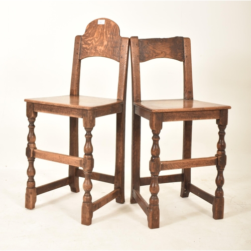 389 - A pair of 19th century oak and elm correctional chairs. Each with panel back and seat rests with eac... 