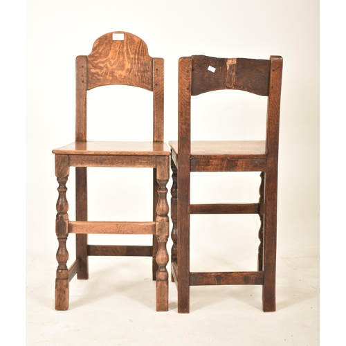 389 - A pair of 19th century oak and elm correctional chairs. Each with panel back and seat rests with eac... 