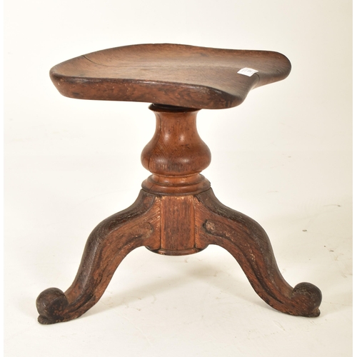 391 - A Victorian 19th century carved oak adjustable piano stool seat. The stool having a saddle shaped se... 