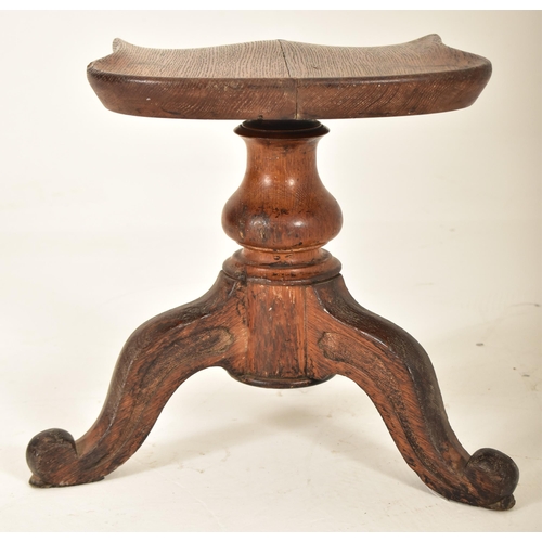 391 - A Victorian 19th century carved oak adjustable piano stool seat. The stool having a saddle shaped se... 