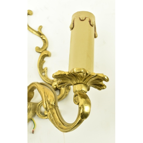 392 - A set of three French inspired 20th century Rococo manner gilded metal wall sconces applique. Each l... 