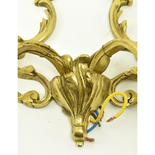 392 - A set of three French inspired 20th century Rococo manner gilded metal wall sconces applique. Each l... 