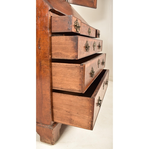 396 - A Queen Anne 18th century burr walnut bureau bookcase or estate cabinet. The cabinet having a scroll... 