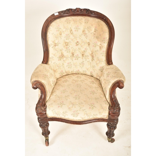 397 - A Victorian 19th century mahogany framed buttoned back saloon armchair. The armchair having a wide b... 