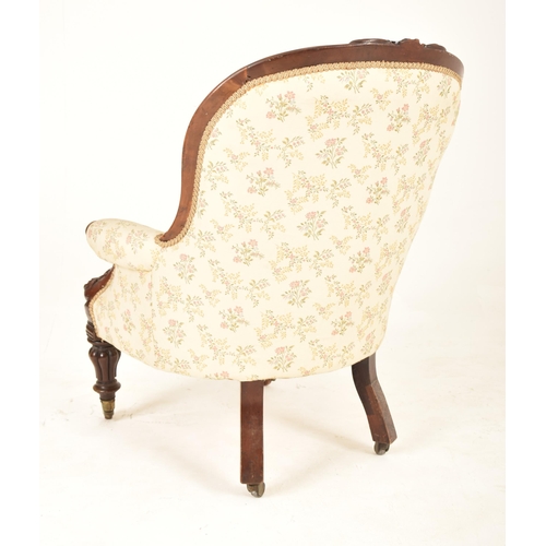 397 - A Victorian 19th century mahogany framed buttoned back saloon armchair. The armchair having a wide b... 