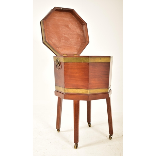 398 - A George III early 19th century mahogany & brass bound wine cooler bucket on feet. The cooler having... 