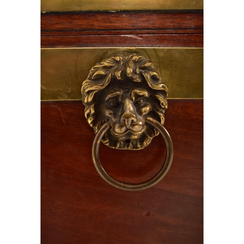 398 - A George III early 19th century mahogany & brass bound wine cooler bucket on feet. The cooler having... 