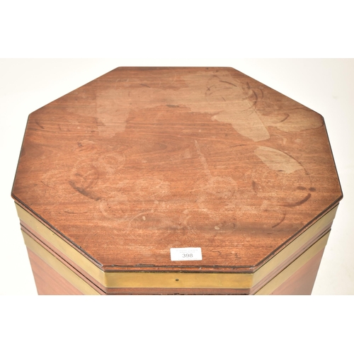 398 - A George III early 19th century mahogany & brass bound wine cooler bucket on feet. The cooler having... 