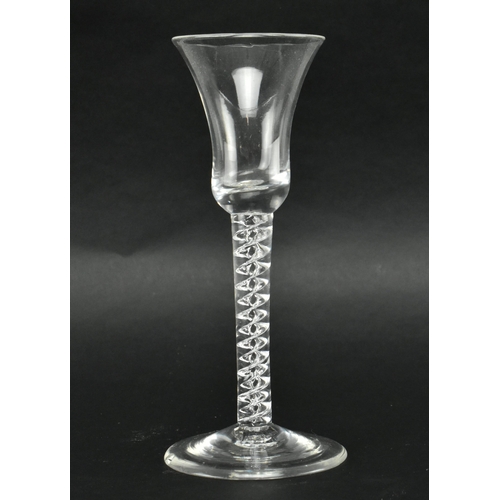 63 - A circa 1760 George III mercury twist wineglass. The glass featuring trumpet bowl over double mercur... 