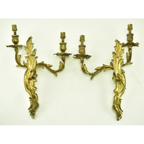 399 - A pair of Rococo style French Louis XV inspired acanthus leaves twin arm wall sconces electroliers. ... 