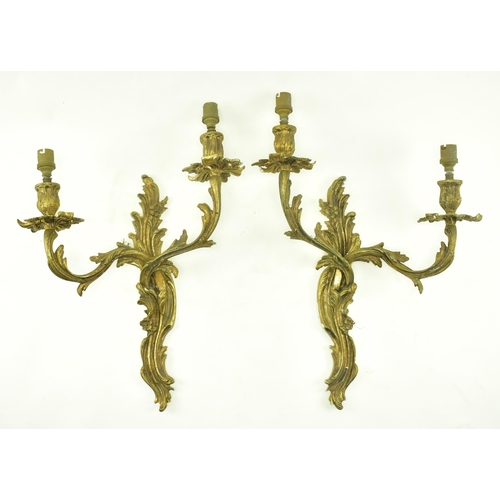 399 - A pair of Rococo style French Louis XV inspired acanthus leaves twin arm wall sconces electroliers. ... 