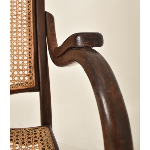 251 - Thonet, Germany - An early 20th century bentwood & cane fireside high back armchair. The chair havin... 