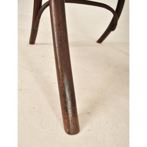 251 - Thonet, Germany - An early 20th century bentwood & cane fireside high back armchair. The chair havin... 