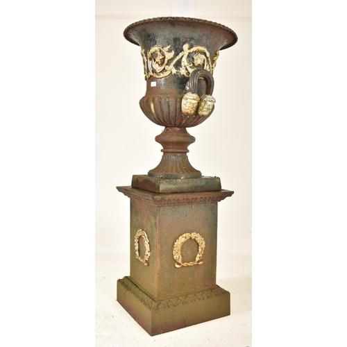 255 - A large 19th century cast iron Campana-shaped garden urn / planter. The campana urn having a gadroon... 