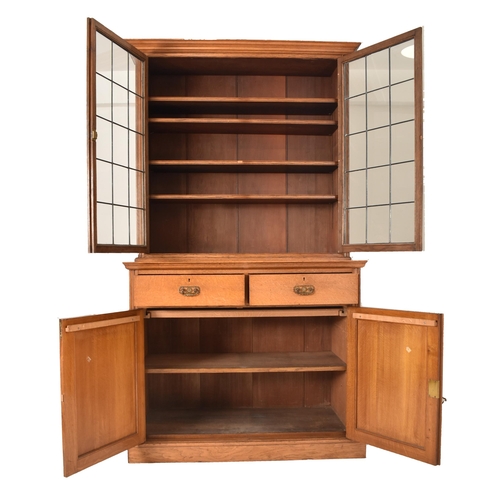 262 - A matching pair of late 19th century Victorian oak bookcase cabinets. Each having led lined glazed d... 