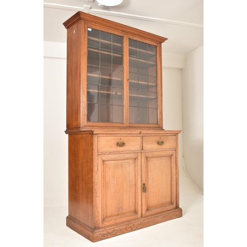 262 - A matching pair of late 19th century Victorian oak bookcase cabinets. Each having led lined glazed d... 