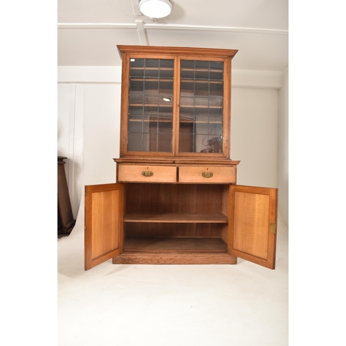 262 - A matching pair of late 19th century Victorian oak bookcase cabinets. Each having led lined glazed d... 