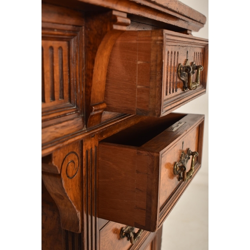 263 - A 19th century Victorian Maple & Co walnut Dickens writing table desk. The desk having a raised gall... 