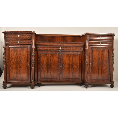 266 - A 19th century Victorian inverted breakfront flame mahogany sideboard credenza / buffet. The sideboa... 