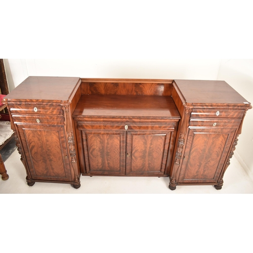 266 - A 19th century Victorian inverted breakfront flame mahogany sideboard credenza / buffet. The sideboa... 