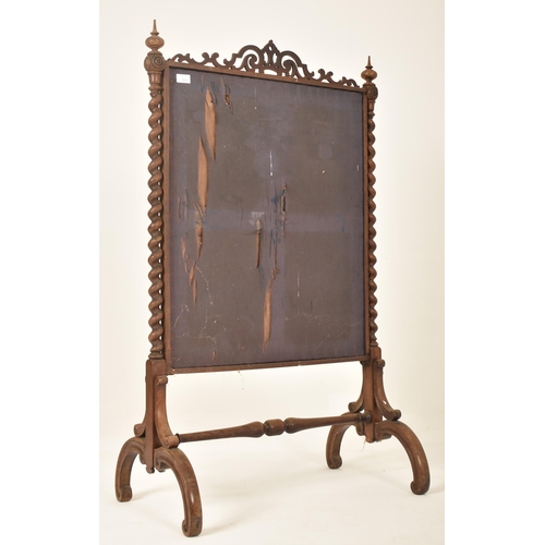 268 - A 19th century rosewood barley twist needlepoint fire screen / discretion panel. The panel having a ... 