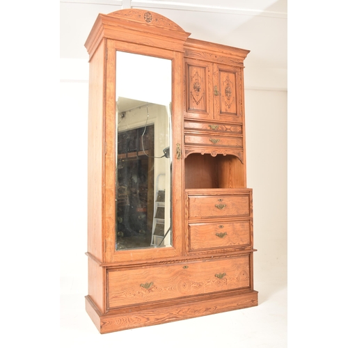 271 - A Victorian 19th century Arts & Crafts pitch pine Compactum double wardrobe. The wardrobe having a h... 