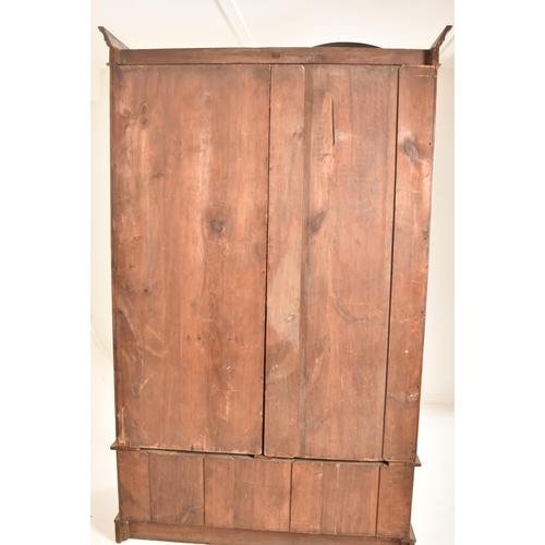 271 - A Victorian 19th century Arts & Crafts pitch pine Compactum double wardrobe. The wardrobe having a h... 