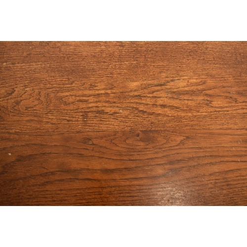 278 - An early 20th century elm wood plank top refectory dining table. The table having a two plank top ra... 