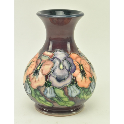 74 - William Moorcroft - a vintage 20th century squat Moorcroft vase in the Pansy pattern. The vase with ... 