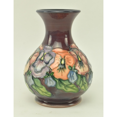 74 - William Moorcroft - a vintage 20th century squat Moorcroft vase in the Pansy pattern. The vase with ... 