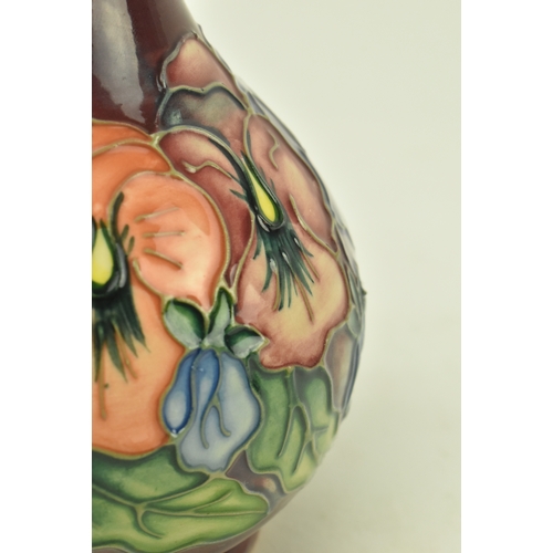 74 - William Moorcroft - a vintage 20th century squat Moorcroft vase in the Pansy pattern. The vase with ... 