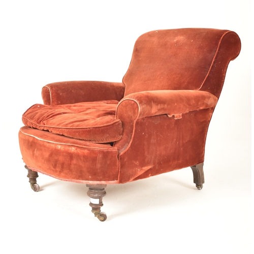 292 - A Victorian 19th century velvet upholstered armchair in the manner of Howard & Sons. The armchair ha... 