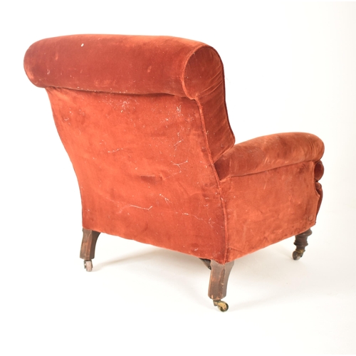 292 - A Victorian 19th century velvet upholstered armchair in the manner of Howard & Sons. The armchair ha... 