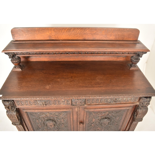 293 - A Flemish Continental 19th century carved oak court cupboard credenza sideboard. The cupboard having... 