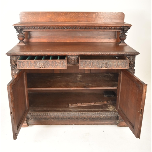 293 - A Flemish Continental 19th century carved oak court cupboard credenza sideboard. The cupboard having... 