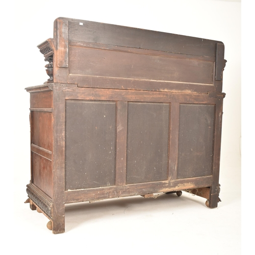 293 - A Flemish Continental 19th century carved oak court cupboard credenza sideboard. The cupboard having... 