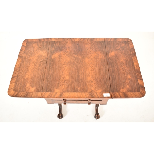 296 - A George IV early 19th century rosewood drop leaf work writing table. The table having a straight to... 