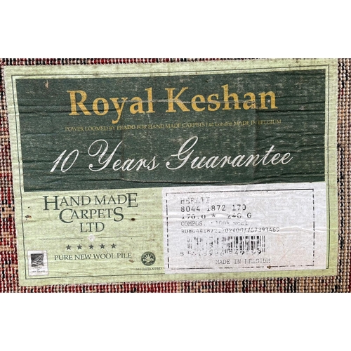 341 - A Royal Keshan pure new wool pile Afghan floor carpet rug. The rug of red ground with central panel ... 