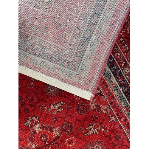 341 - A Royal Keshan pure new wool pile Afghan floor carpet rug. The rug of red ground with central panel ... 